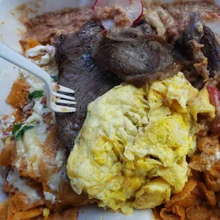 Chilequiles on point! My favorite food truck great fresh made pupusas the best I've had so far! Really nice respectful couple