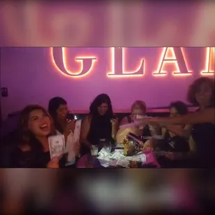 a group of women sitting around a table