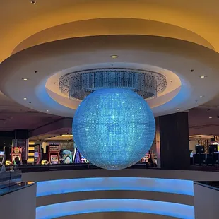 The beautiful chandelier in the middle between both escalator up-and-down! By the PH Glass Bar Lounge!