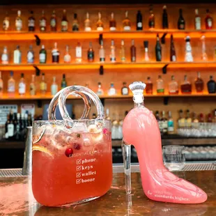 "Booze Bag" and "Glass Slipper" large format brunch cocktails at Glass Ceiling Rooftop.