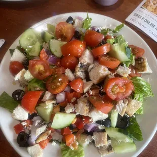 Acropolis salad with chicken and cucumbers added.