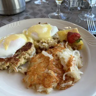 Crab cake eggs Benedict!! Delicious and crab cake was moist and seasoned with fresh herbs - no filler bread crumbs!!