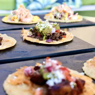 a row of tacoss on a table