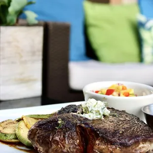 steak and vegetables on a white plate