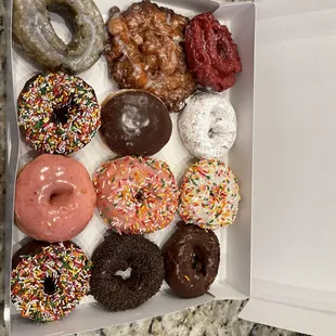 Red velvet, apple fritter, blueberry, Boston cream, powdered, strawberry glazed, sprinkled.