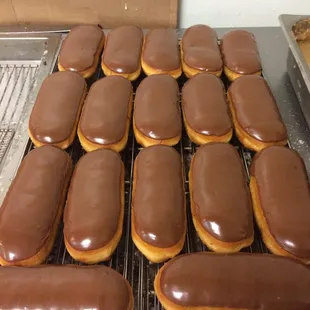 chocolate covered donuts on a cooling rack