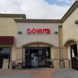 the entrance to a donut shop