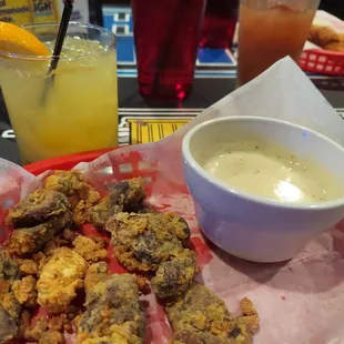 a bowl of soup and fried chicken