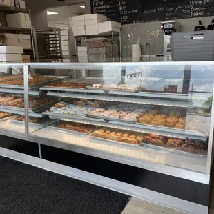 a display case with a variety of pastries