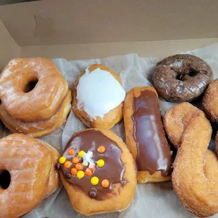 Glazed, Jelly filled, White Creme filled, cream filled eclair, chocolate glazed, and cinnamon sugar twists