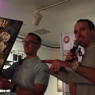 Drew Brees and Blair doing live auction at Gleason Gras