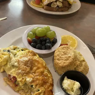 Mediterranean omelette, Sage biscuit and fresh fruit. Husband had brioche French toast with bananas.