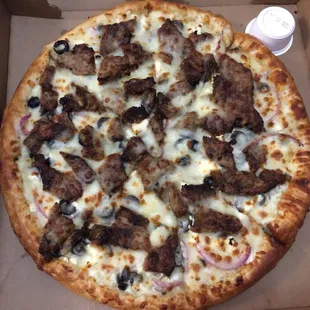 Gyro pizza has onions and olives.