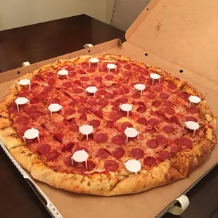 a pepperoni pizza in a box