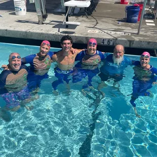 Our coaches are so awesome that they swim in their superhero costumes during the Coaches Relay at Champs