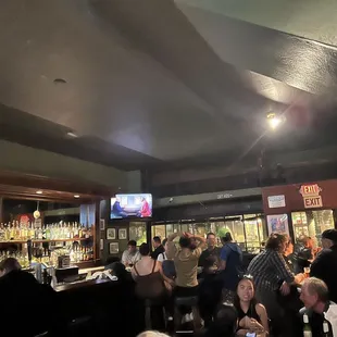 a crowd of people at a bar