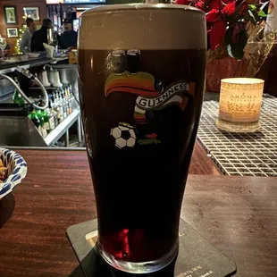 a pint of beer on a table