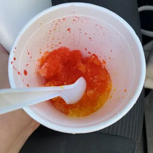  plastic cup with a spoon in it