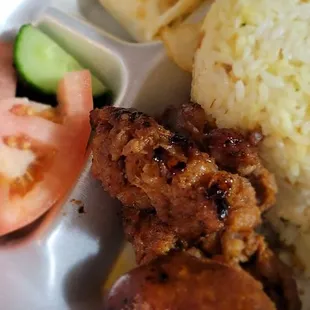 Longsilog - longanisa, over easy egg, garlic rice, fresh tomato &amp; cucumber.