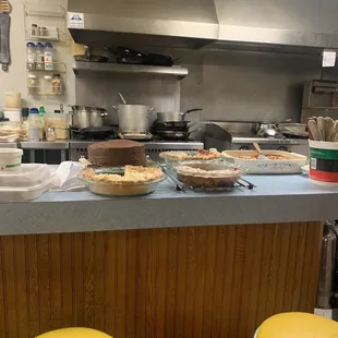 a counter with pies and pie pans