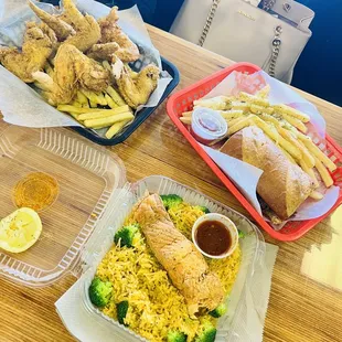 Wing basket, Philly cheesesteak sandwich, fried salmon over rice with broccoli