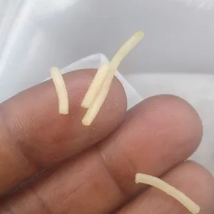 Noodles they clam is broccoli and rice.