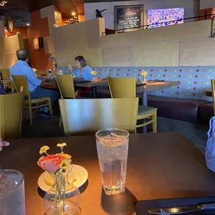 two people sitting at a table in a restaurant