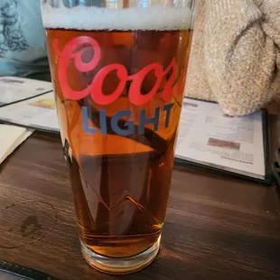a pint of beer on a table
