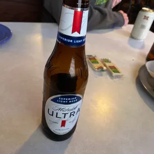 a bottle of beer on a table