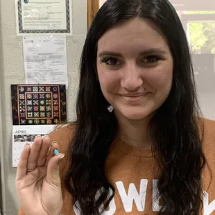 A Gem holding a Gem (Turquoise), I purchased. I think maybe she owns the place because she treats it like it is hers, very professional. Thx