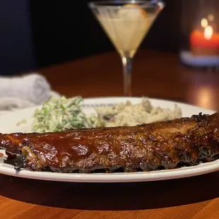  a plate of ribs and mashed potatoes