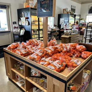 a display of carrots in a grocery store