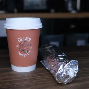 a cup of coffee and a wrapper