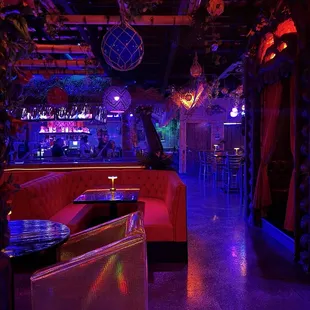 Chill vibe atmosphere with bartender (in a bun) with attitude in the background.