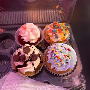 a variety of frosted cupcakes