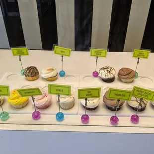 a variety of cupcakes on display