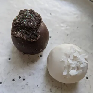 two chocolate truffles on a plate