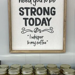 jars of coffee and a sign that says i'm gonna need you to be strong today