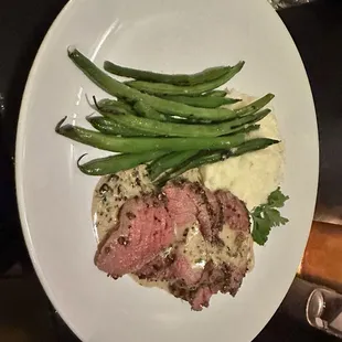Wagyu steak, mash potatoes, and charred green beans.