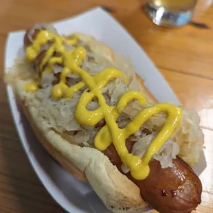 a hot dog with mustard
