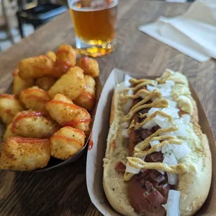 a plate of fried shrimp and a glass of beer