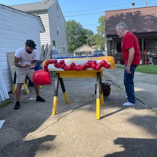 Me and Dougie himself painting the giant glizzy that&apos;s mounted on the glizzy cart!