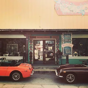 Our storefront in Patagonia, graced by classic cars