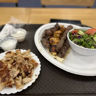a plate of food and a bowl of salad