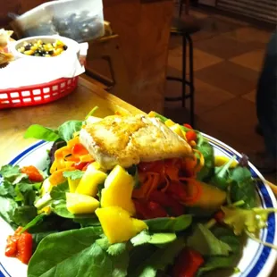 Salmon Salad fresh spinach, carrot , Red Peppers, Mango, Topped w Honey Chipotle Vinaigrette
