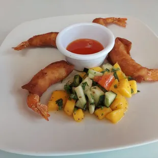 Shrimp in a blanket with mango salsa