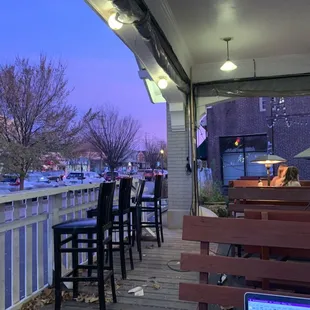 a view of a patio with a laptop on the table
