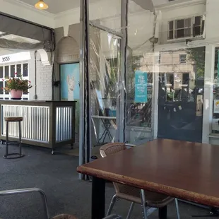 a view of a coffee shop through a glass door