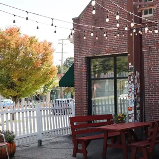 a patio with a table and chairs