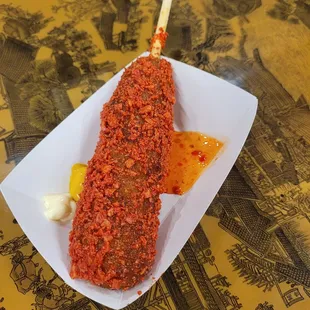Korean corn dog coated in Takis